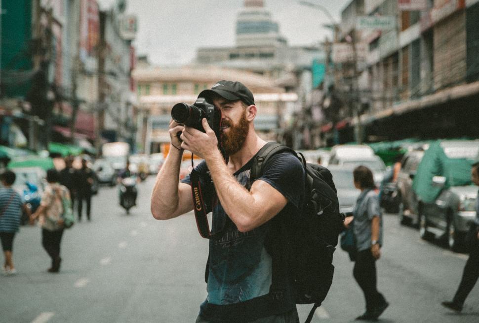 Free Image of Man With Beard Taking Picture 