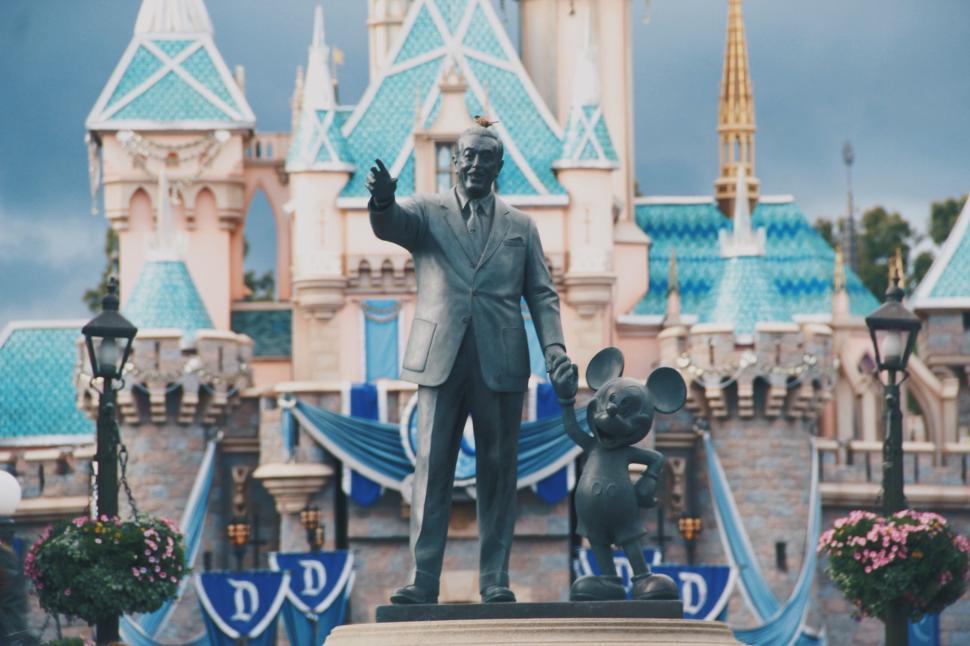 Free Image of Statue of Walt and Mickey Mouse in Front of a Castle 