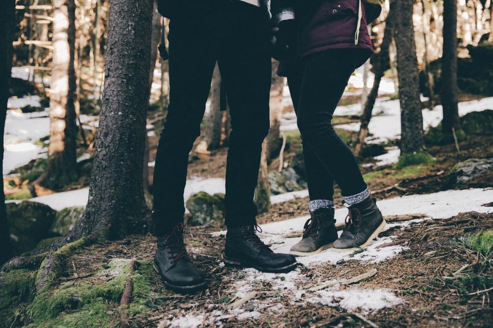 Free Image of Man and Woman Standing in the Woods 
