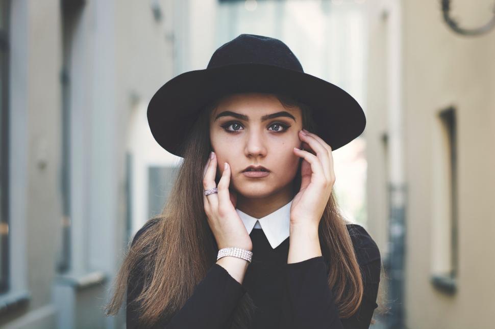 Free Image of Woman in Black Hat and Dress 
