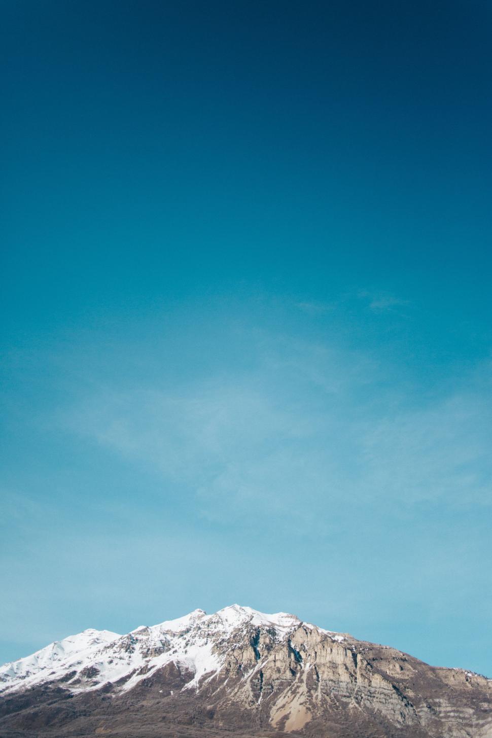 Free Image of Snow Covered Mountain Under Blue Sky 
