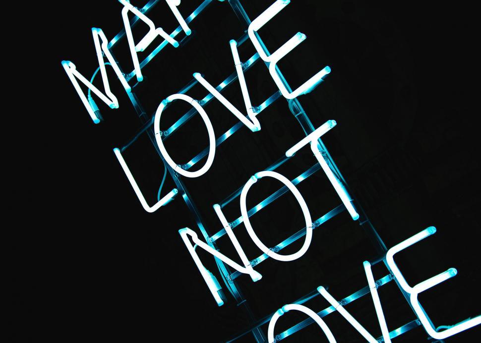 Free Image of Neon Sign: Make Love Not War 