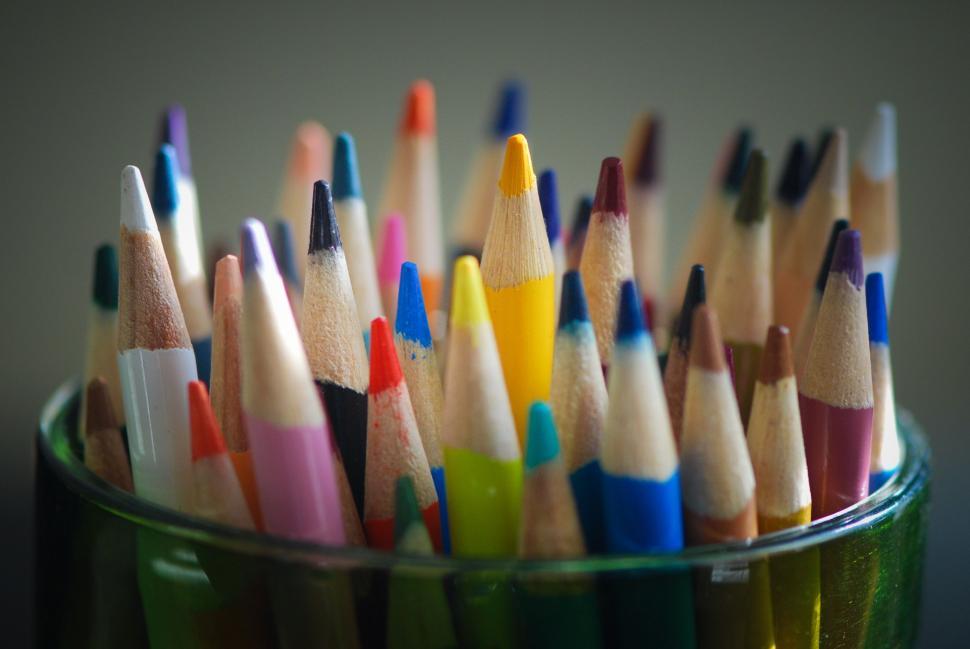Free Image of Cup Full of Colored Pencils on Table 