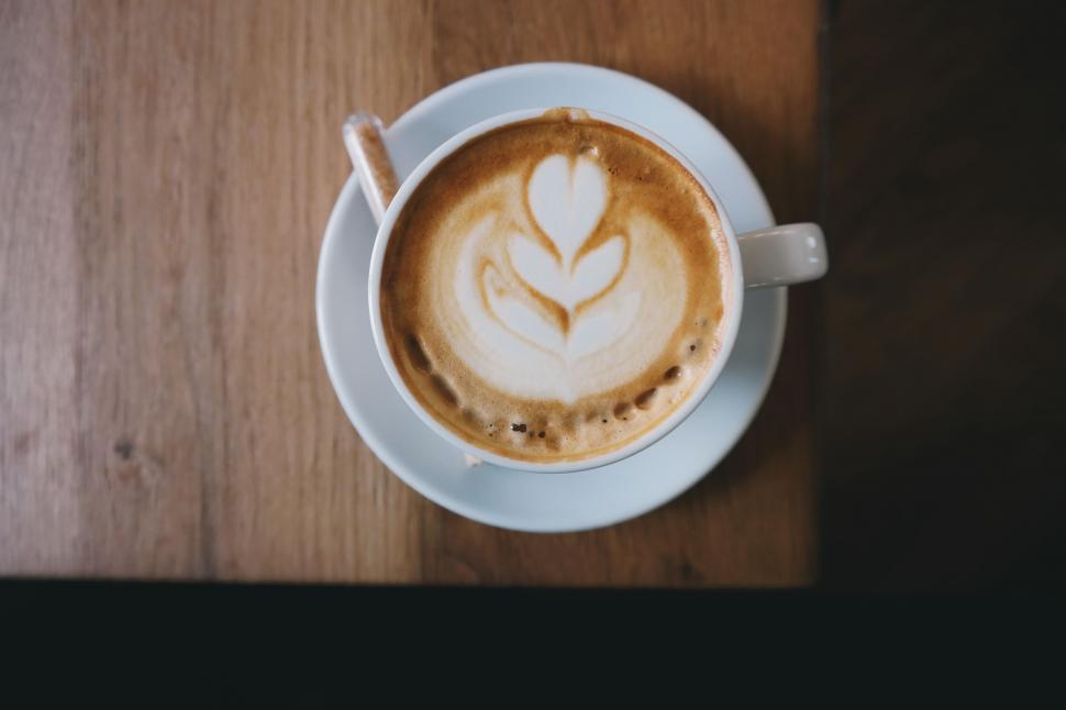 Free Image of A Cappuccino on a Saucer on a Wooden Table 