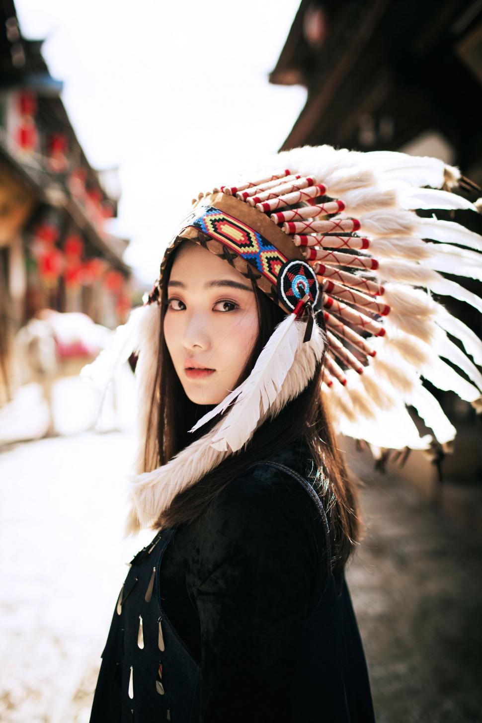 Free Image of Woman Wearing a Feather Headdress 