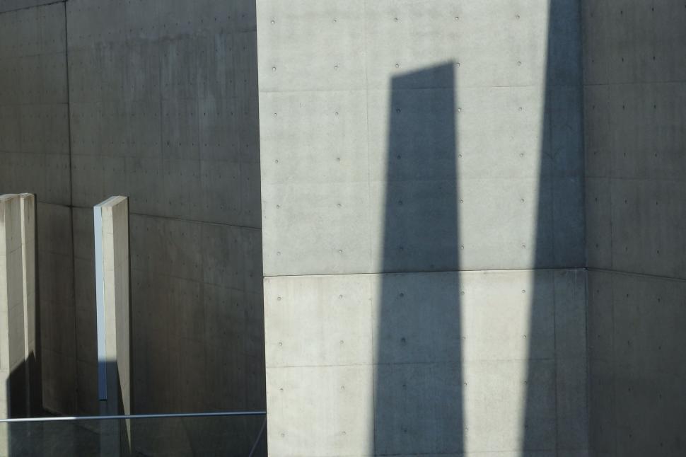 Free Image of Shadow of Person Standing in Front of Building 