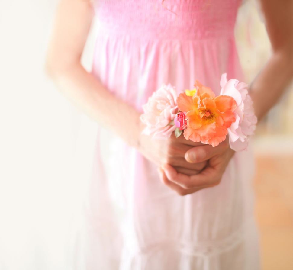 Free Image of Woman in Pink Dress Holding Bouquet of Flowers 