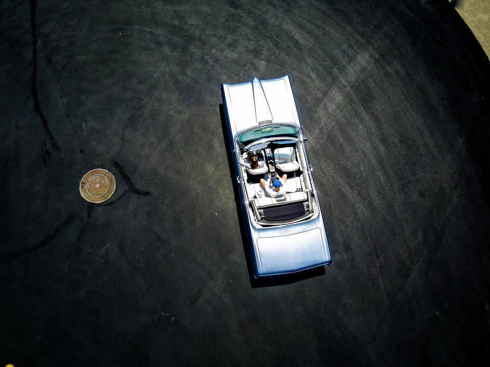 Free Image of Small Silver Car on Black Surface 