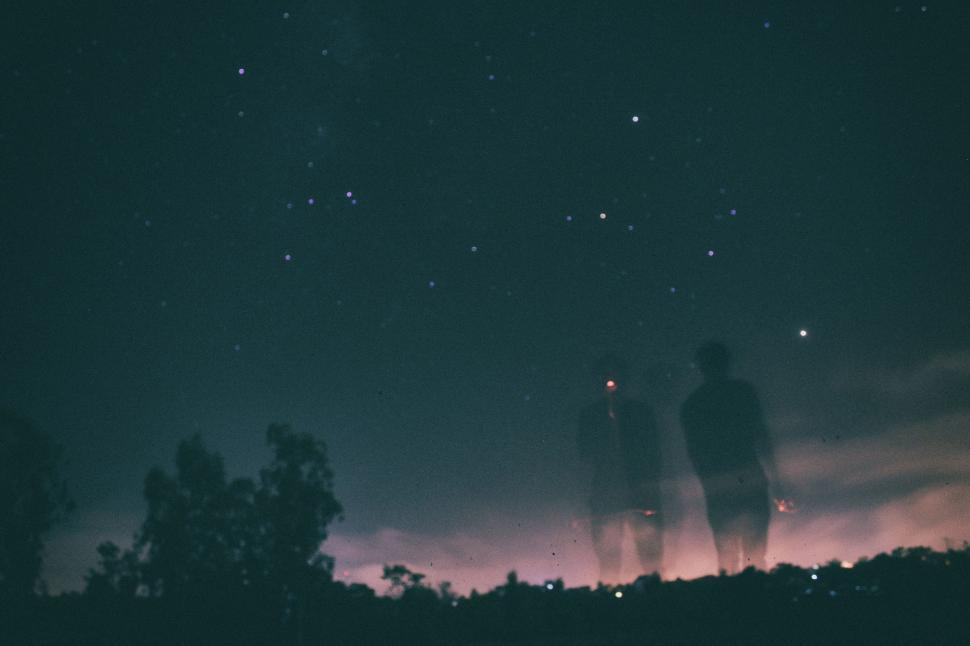 Free Image of People Standing on Hill Under Star-filled Sky 