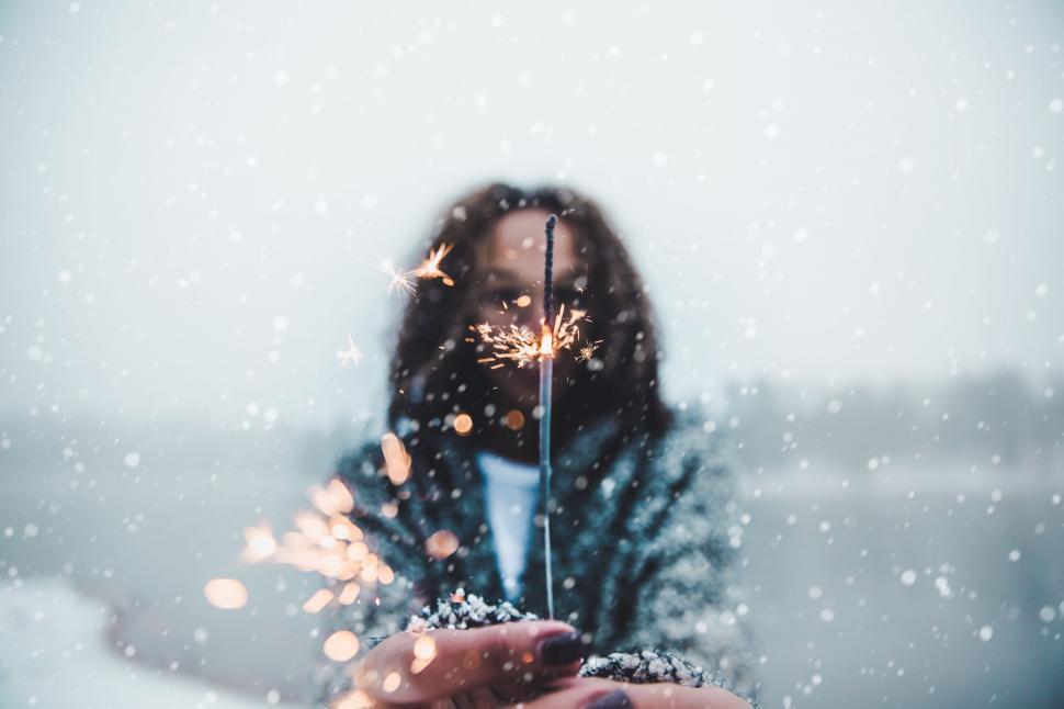 Free Image of Woman Holding Sparkler in Hand 