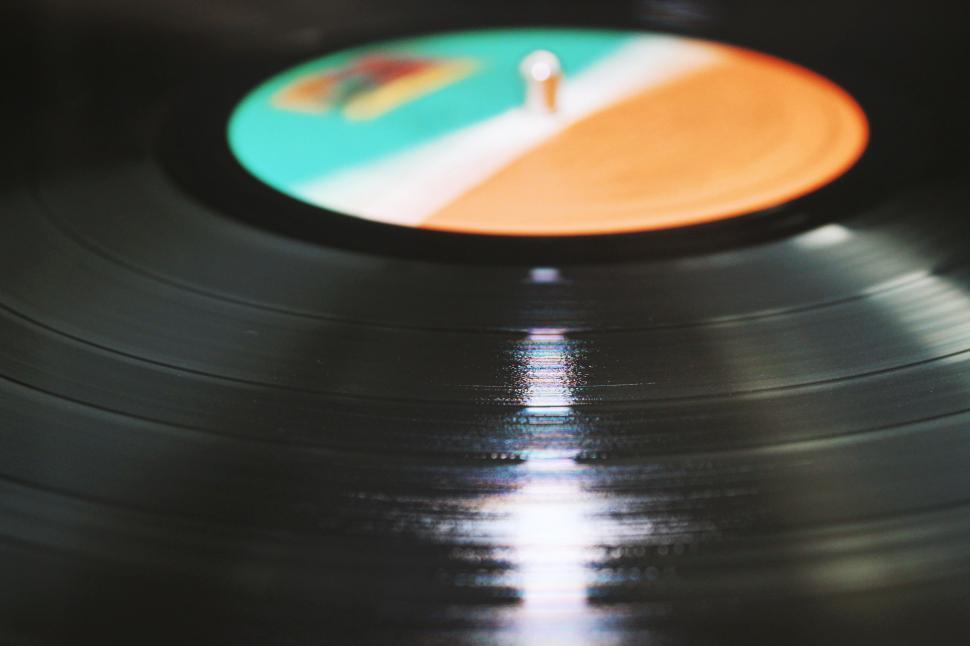 Free Image of Vinyl Record With Orange and Blue Disc 