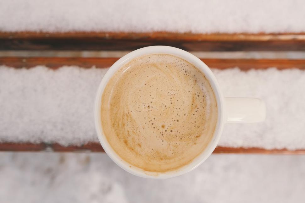 Free Image of Cup of Coffee on Snow-Covered Table 