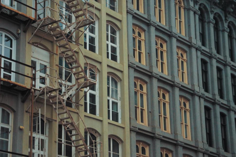 Free Image of Tall Building With Many Windows and Fire Escape 