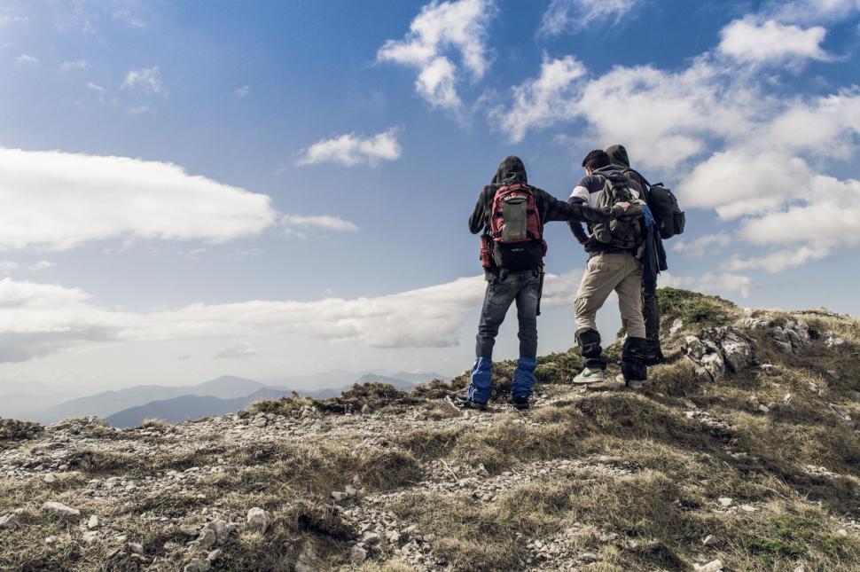 Free Image of Two People Standing on Top of a Mountain 