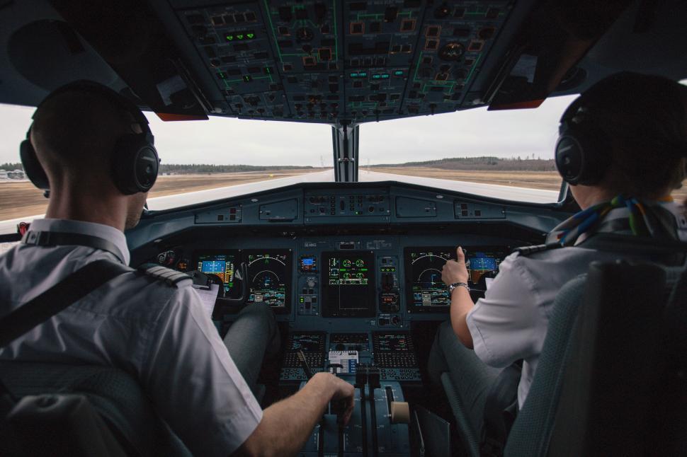 Free Image of Two Pilots in the Cockpit of an Airplane 