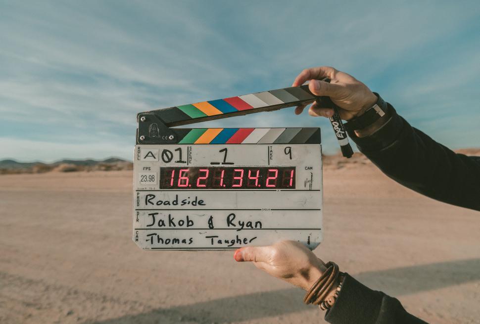 Free Image of Person Holding Movie Clap in Desert 