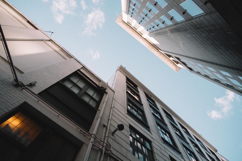 Free Image of Looking Up at Two Tall Buildings in a City 