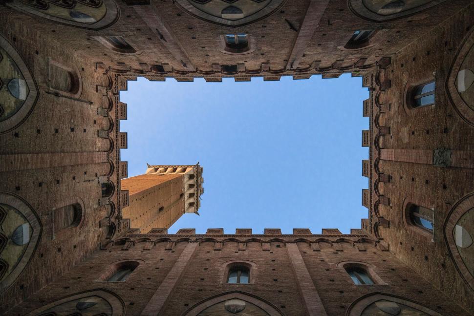 Free Image of Looking Up at a Tall Building 