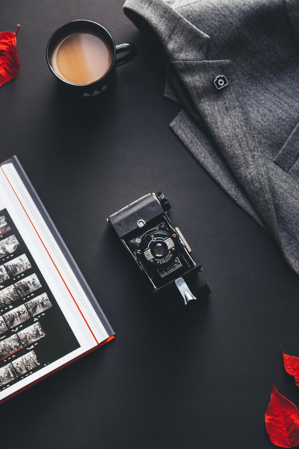 Free Image of Camera and Book on Table 