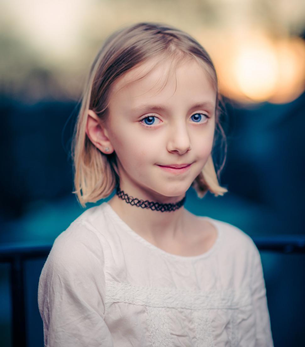 Free Image of Young Girl in White Shirt and Black Choker 