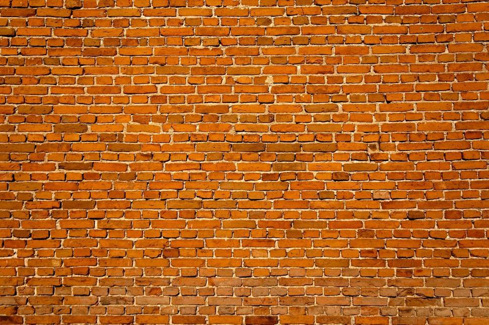 Free Image of Red Brick Wall With Fire Hydrant 