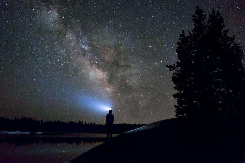 Free Image of Person Standing on Hill Looking at Stars 
