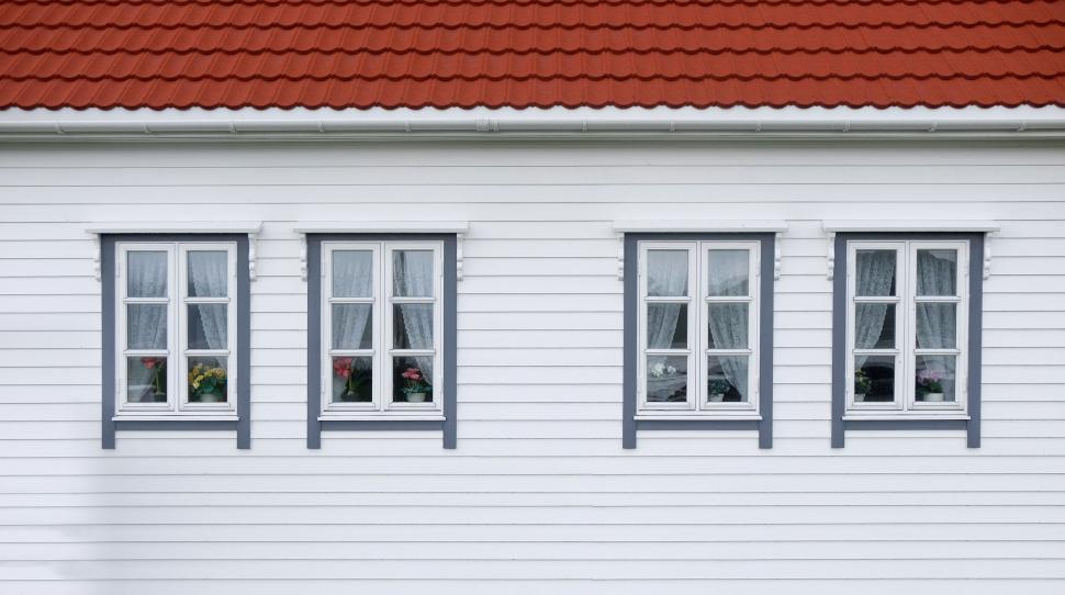 Free Image of White House With Three Windows and Red Roof 