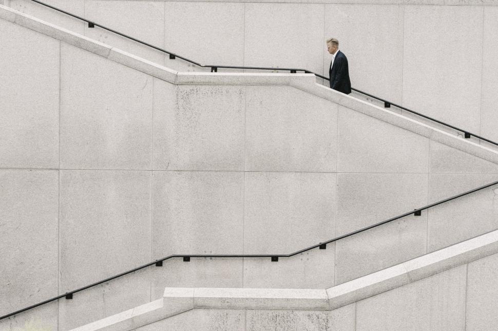 Free Image of Businessman in Suit Climbing Stairs 