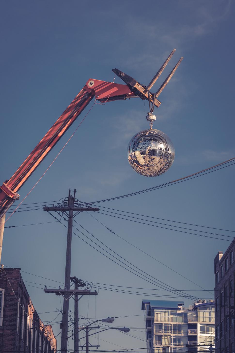 Free Image of Mirror Ball Hanging From Pole 