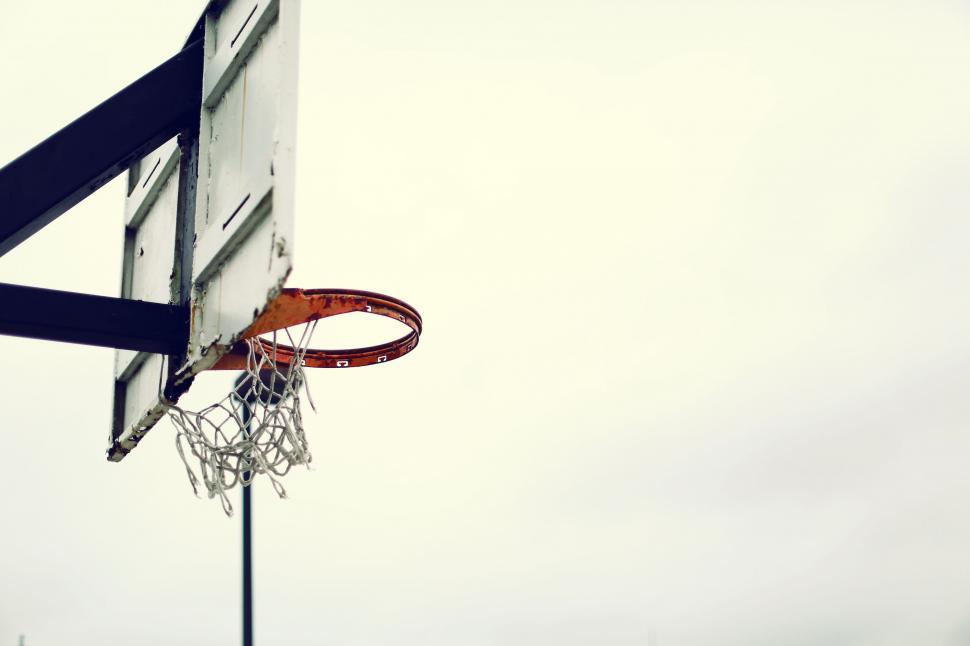 Free Image of Basketball Hoop With Basketball Going Through 