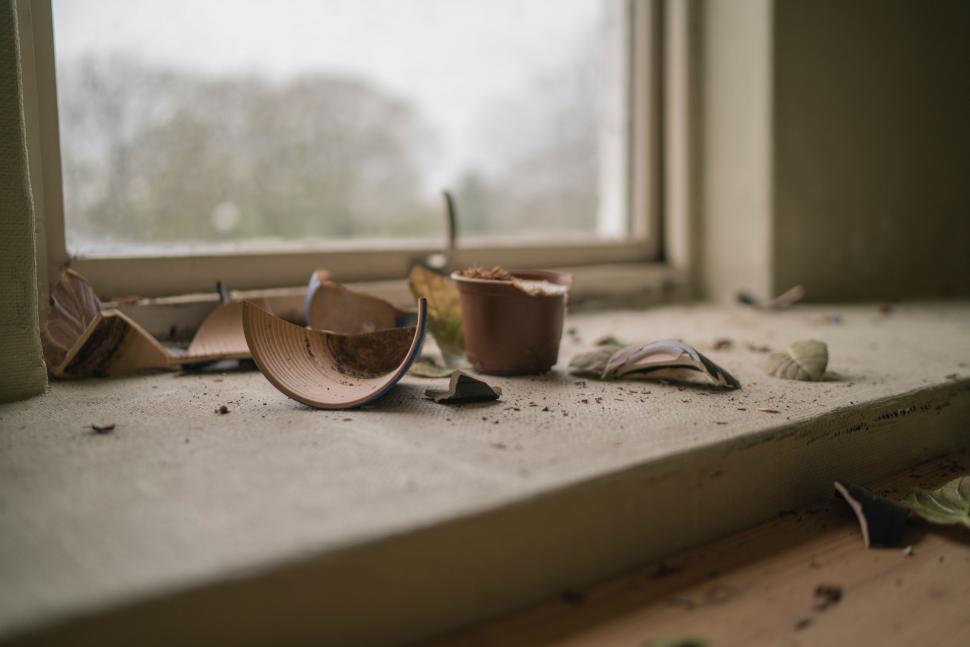 Free Image of Dirty Window Sill With Broken Cup 