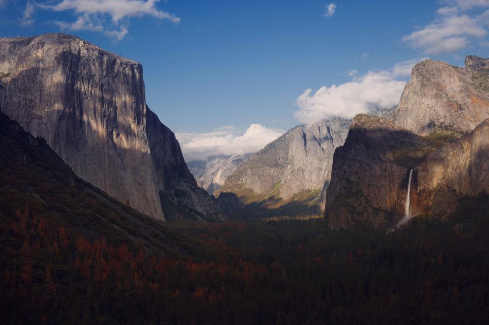 Free Image of Majestic Mountain Range With a Central Waterfall 