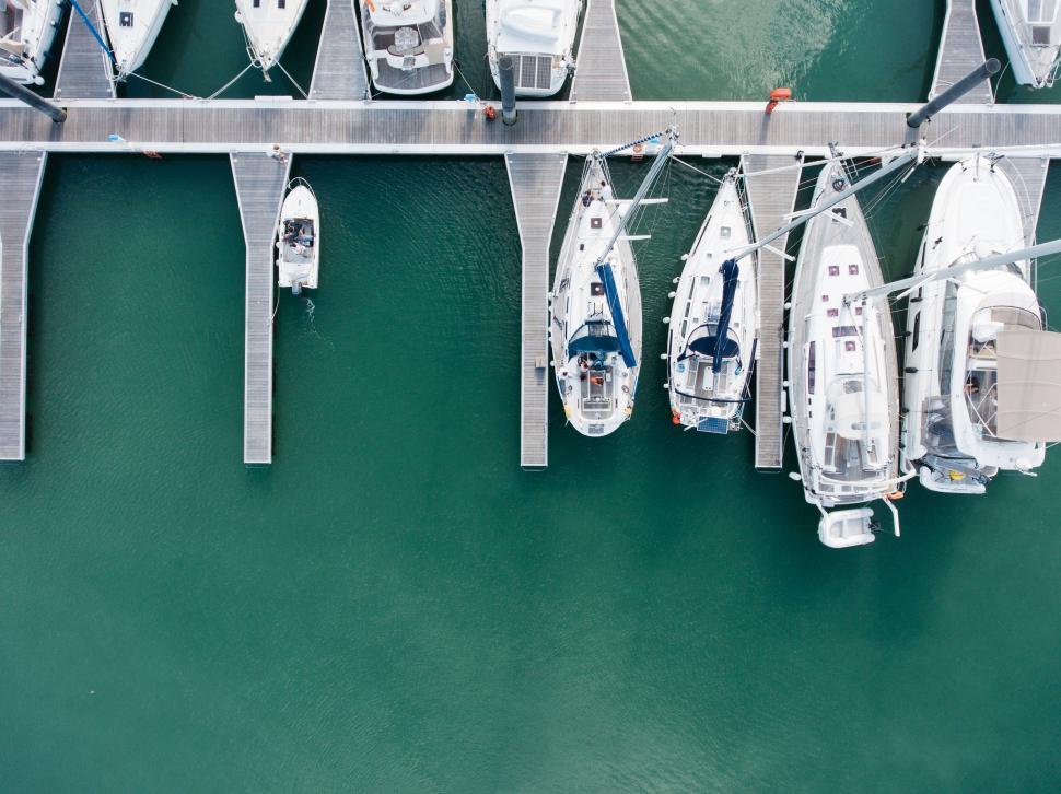 Free Image of Group of Boats Docked at Pier 