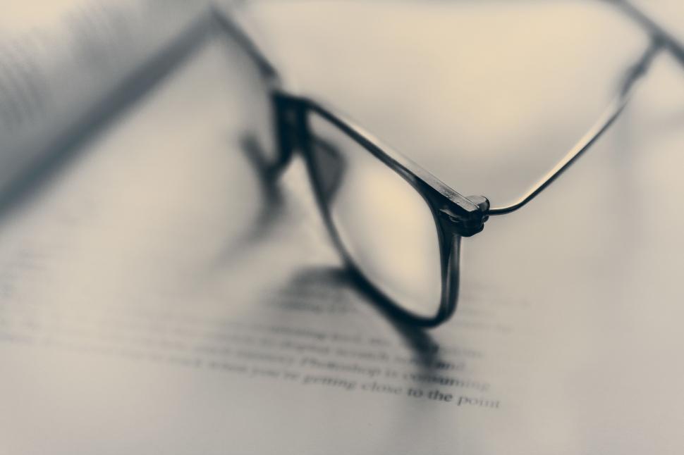 Free Image of Glasses on Top of Book 