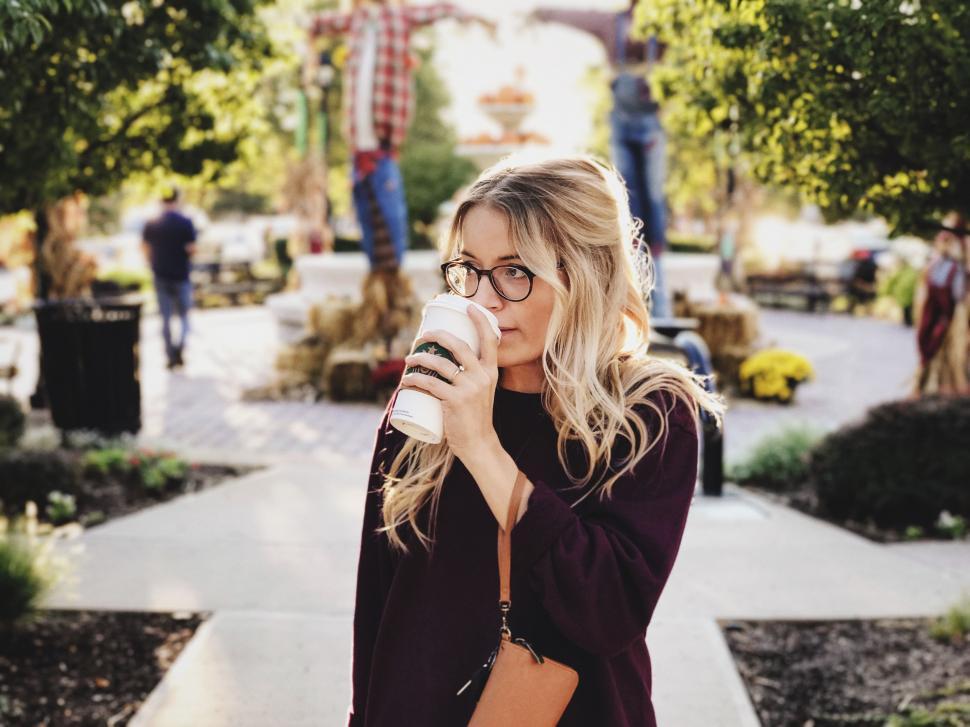 Free Image of Woman in Glasses Drinking From a Coffee Cup 