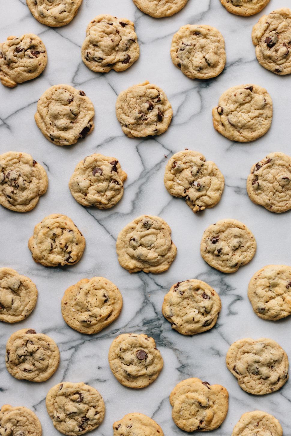 Free Image of Chocolate Chip Cookies on Marble Surface 