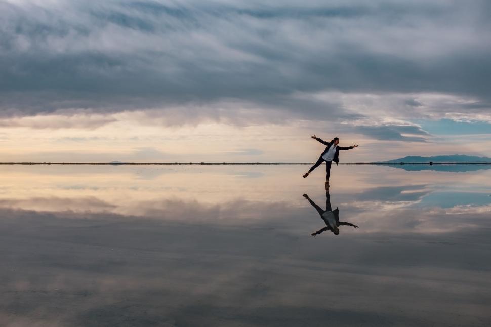 Free Image of Person Standing in Middle of Lake 