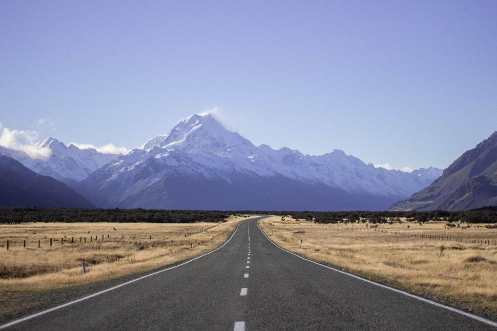 Free Image of Empty Road With Mountains in the Background 