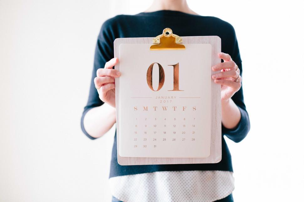 Free Image of Woman Holding Calendar With Number Ten 