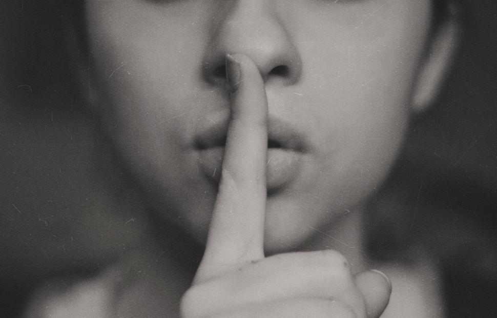 Free Image of Woman Making a Hush Gesture 
