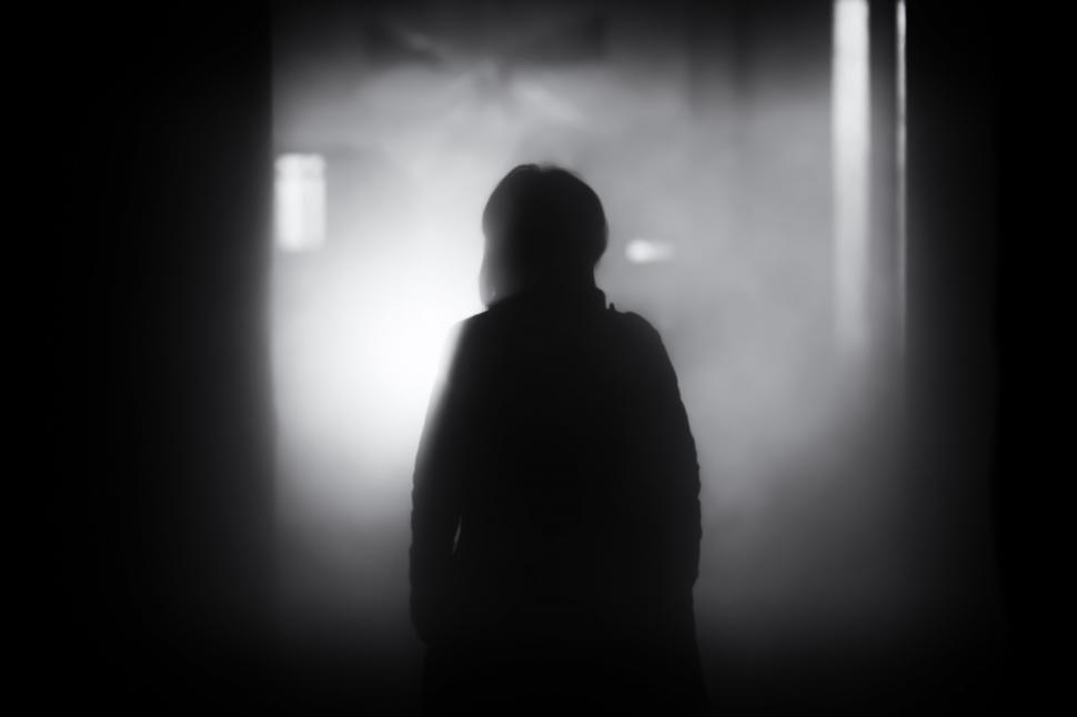 Free Image of Person Standing in Dark Room 