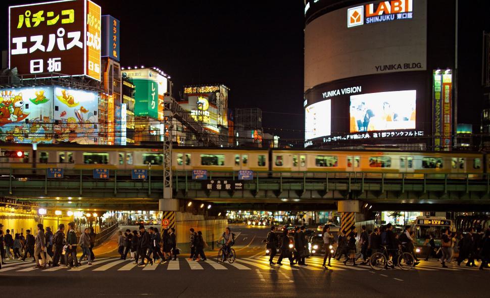 Free Image of Group of People Crossing Street at Night 