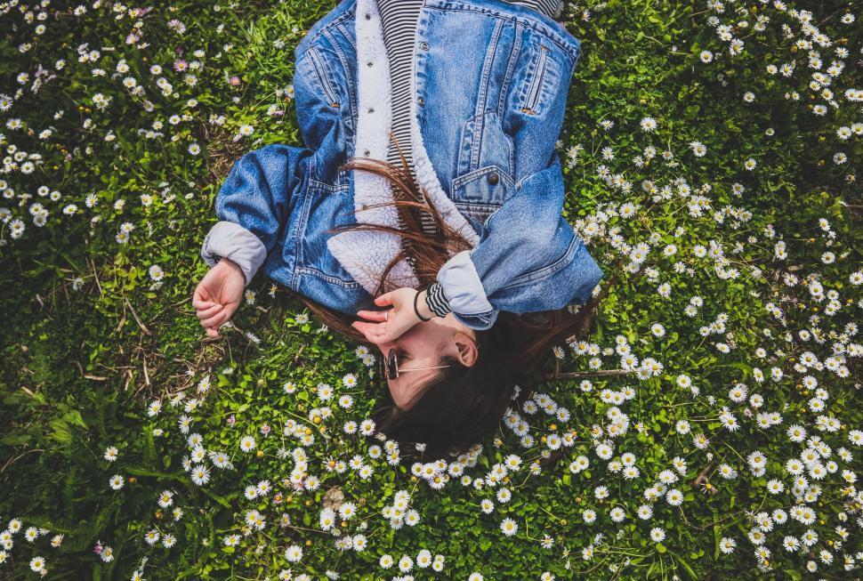 Free Image of Person Laying in Field of Flowers 