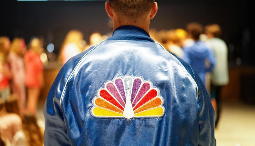 Free Image of Man Wearing Blue Jacket With Shell Logo 
