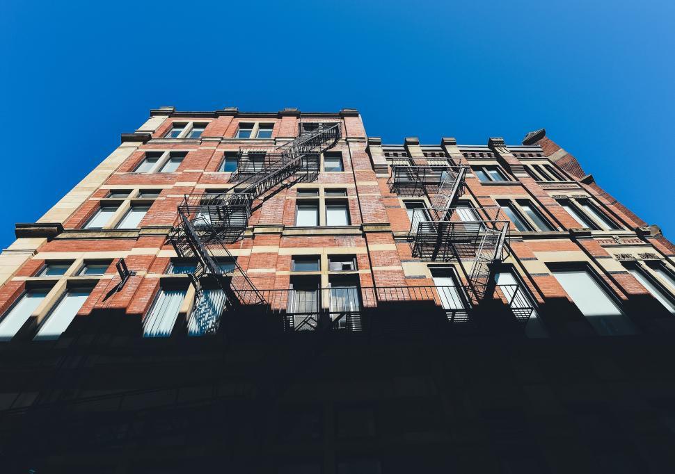 Free Image of Tall Building With Windows and Balconies 