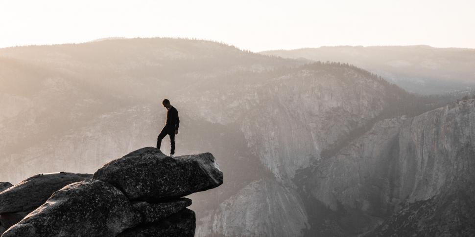Free Image of Man Standing on Cliff Edge 