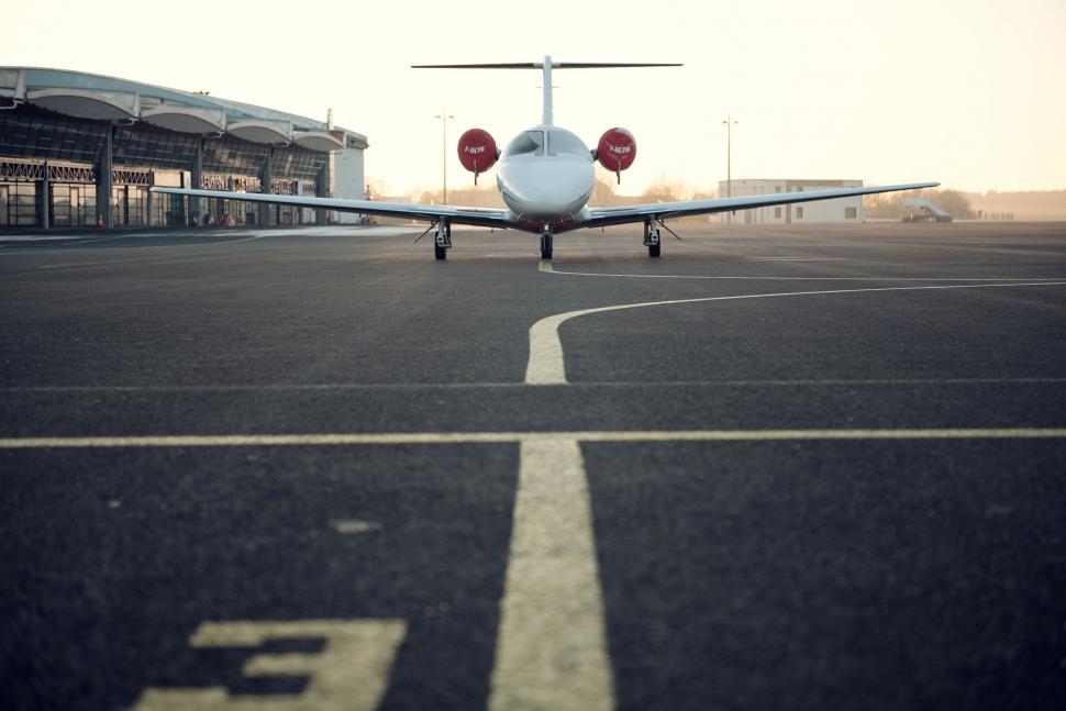 Free Image of Small Airplane Parked on Airport Tarmac 