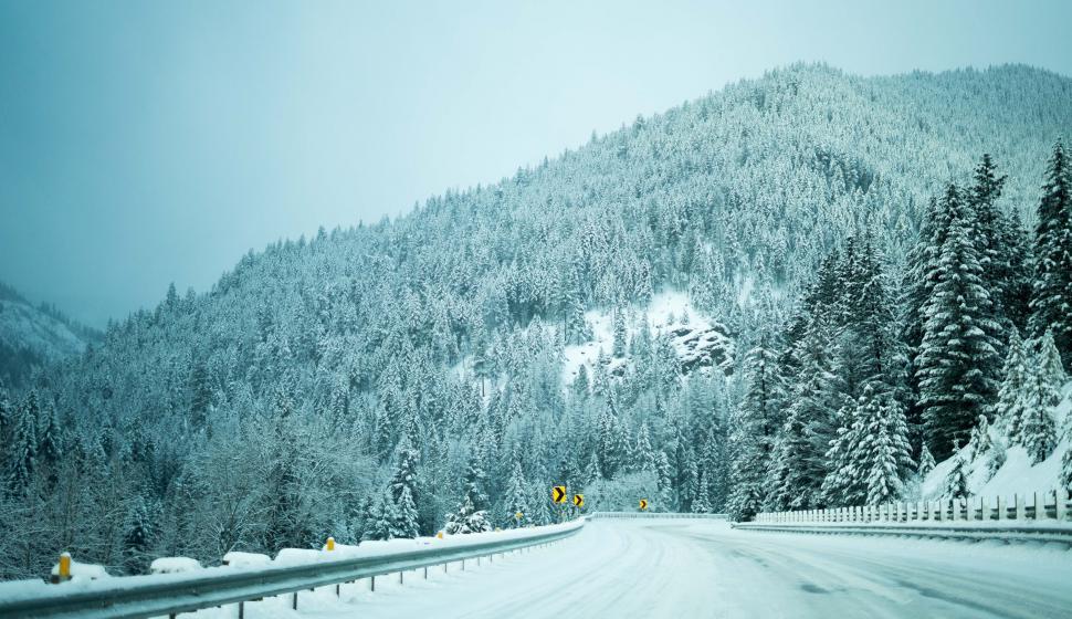 Free Image of Snowy Road With Mountain in Background 