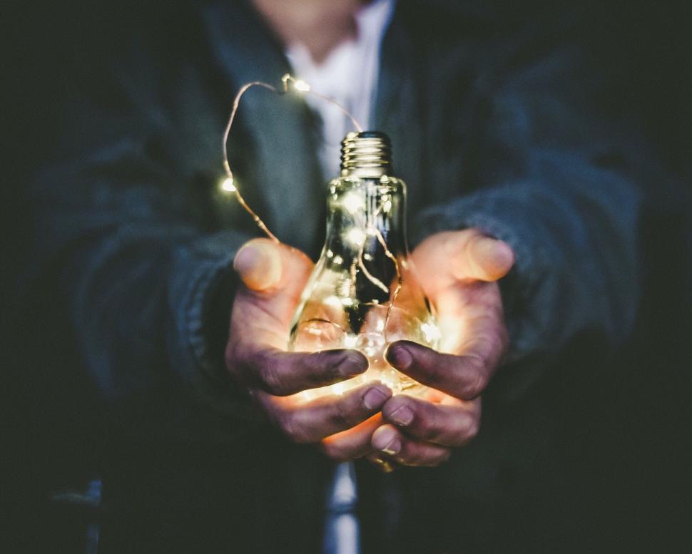 Free Image of Person Holding Light Bulb 