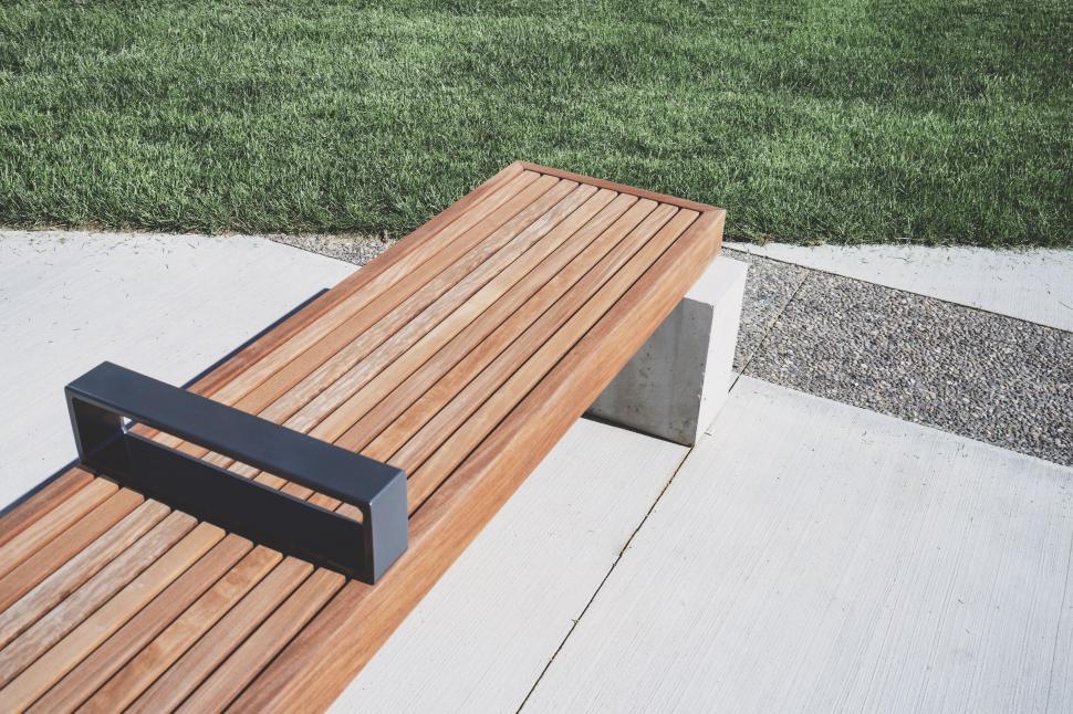 Free Image of Wooden Bench on Sidewalk 